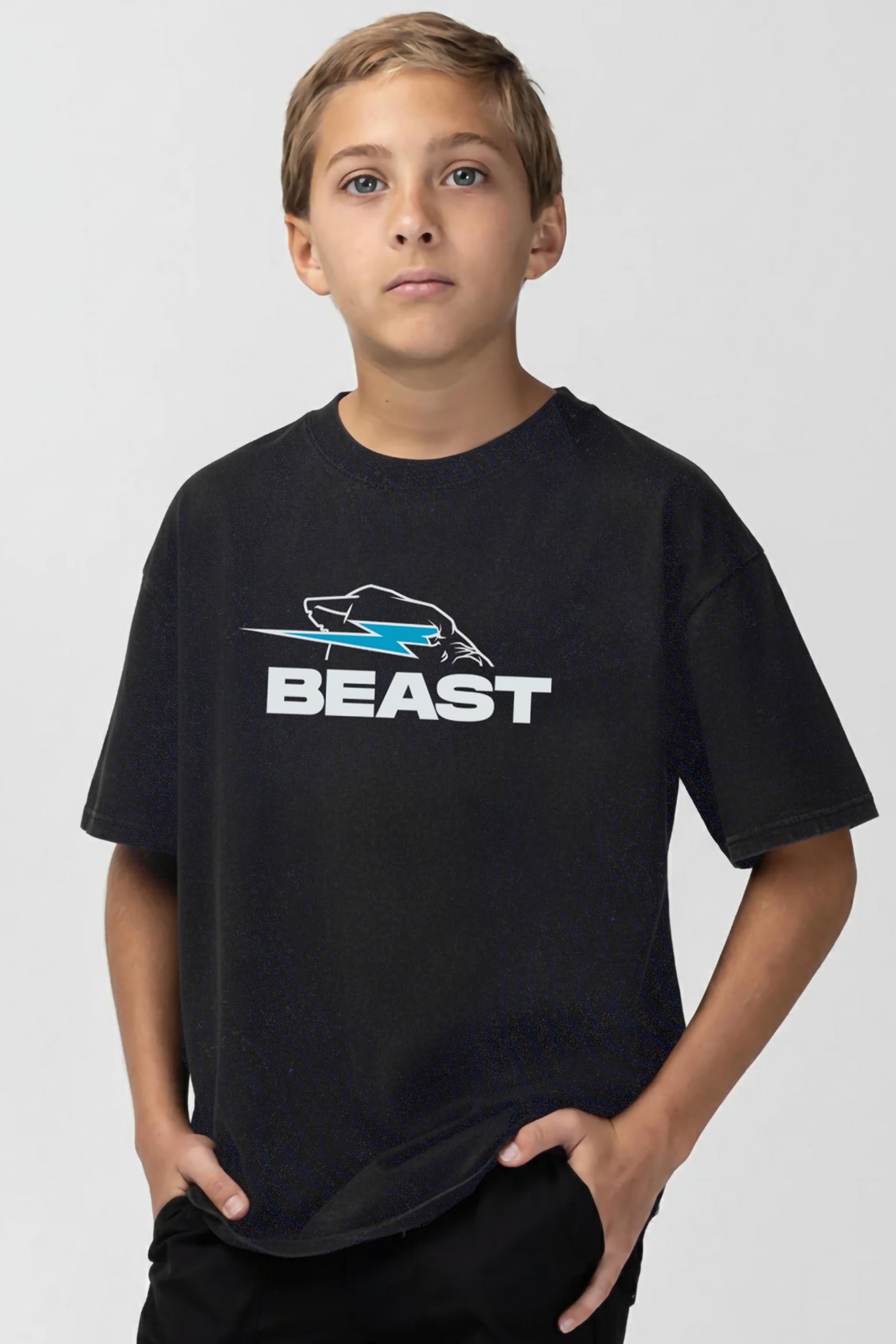 Child wearing a black t-shirt with 'BEAST' logo on a plain background